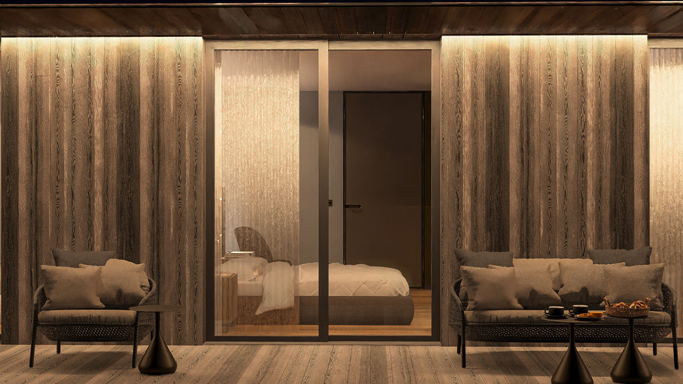 Contemporary bedroom wing illuminated at dusk with floating terraces, warm interior lighting, natural stone walls, and surrou