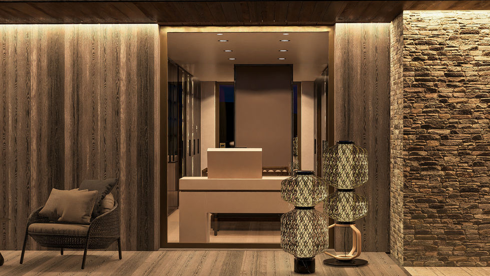 Contemporary bedroom wing illuminated at dusk with floating terraces, warm interior lighting, natural stone walls, and surrou