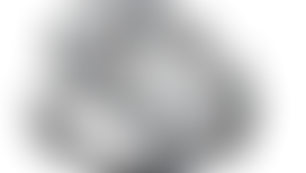 Two intertwined diamond rings feature large central stones, surrounded by smaller diamonds. The metal bands are shiny and reflective.