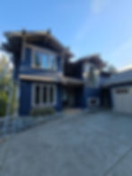 Blue house exterior, renovated by home renovation experts