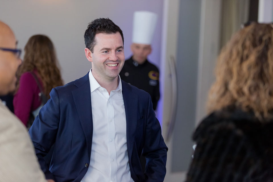 Team Members Chatting at Grand Opening