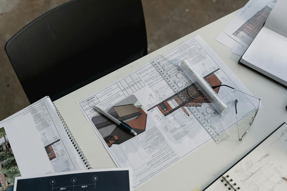 An architect's desk at the TectArch studio, illustrating the professional process of how architects work in South Africa, from the initial concept model and blueprints to the final award-winning design.