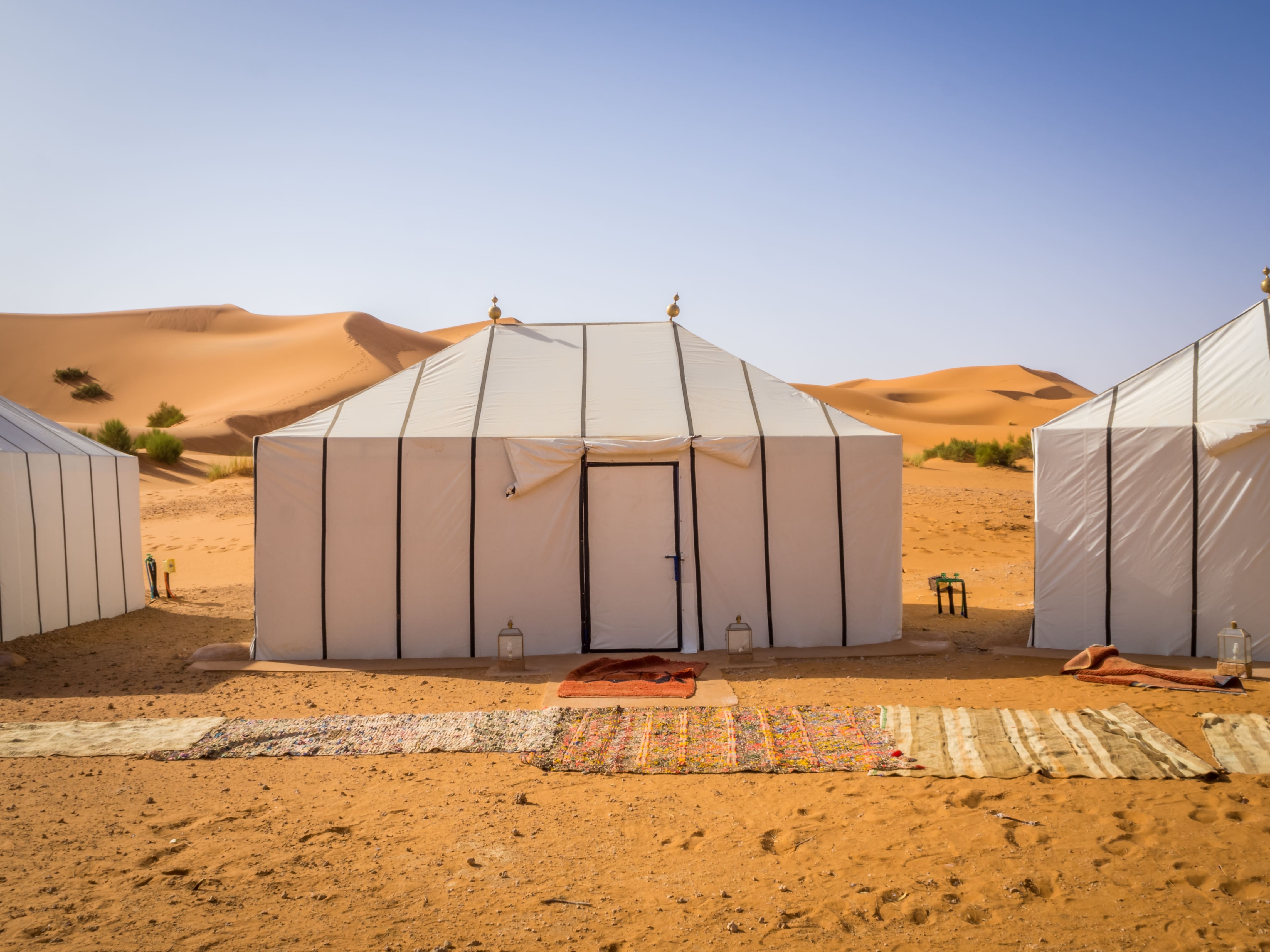 white-berber-tents-sahara-desert-morocco-with-carpets-sandy-ground.jpg