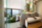 Luxury bedroom at Vyn Guesthouse with floor-to-ceiling windows and panoramic mountain views
