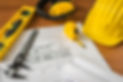 construction-plans-with-yellow-helmet-dr