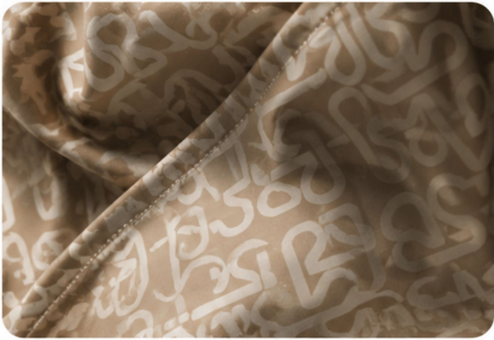 Armira textile pattern detail featuring the brand identity