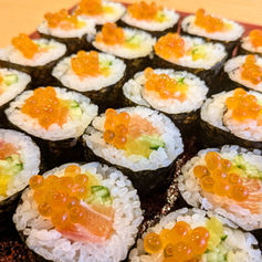 Japanese salmon rolls topped with salmon roe.