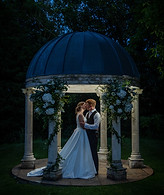 wedding couple under arch