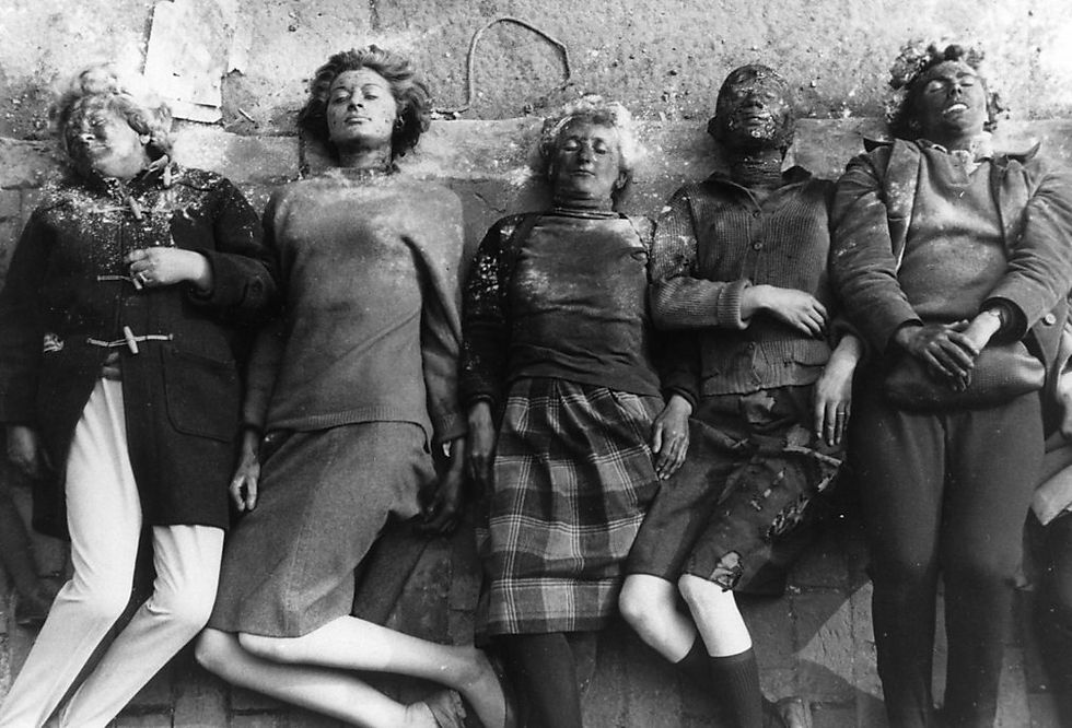 A scene from Peter Watkins's 1966 BBC televison film The War Game showing a row of corpses.