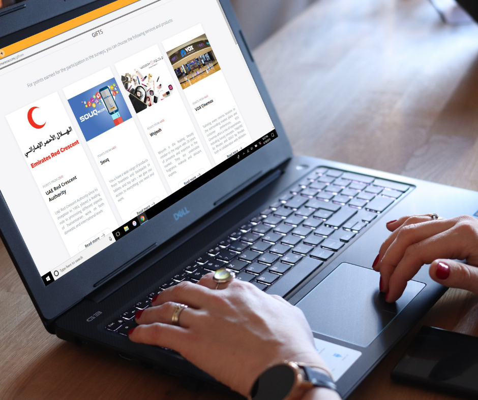 A lady using the OpinionArena website on her laptop to complete surveys in the UAE.