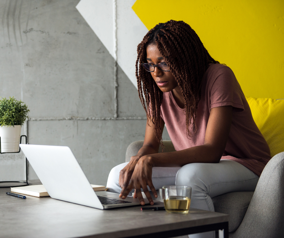 A lady working on her freelance business in a workspace.