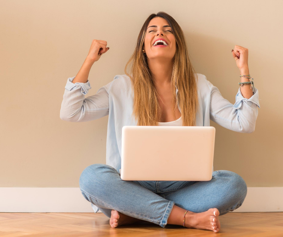 A lady feeling happy about her successful side hustle.