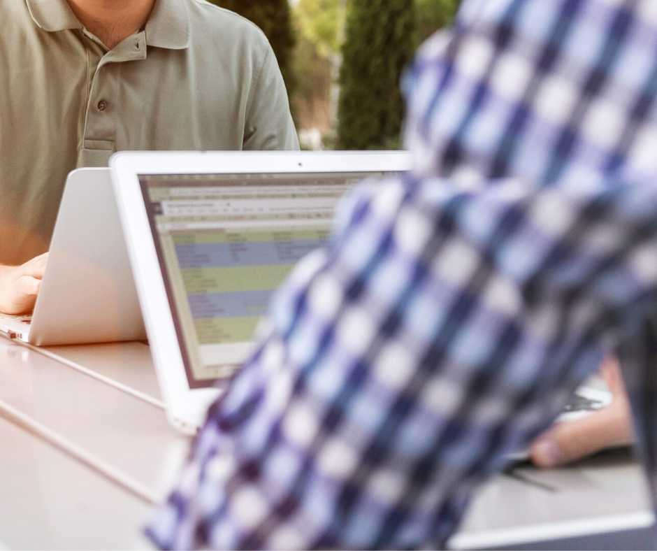 Employees using LinkedIn on their laptop to network with others.
