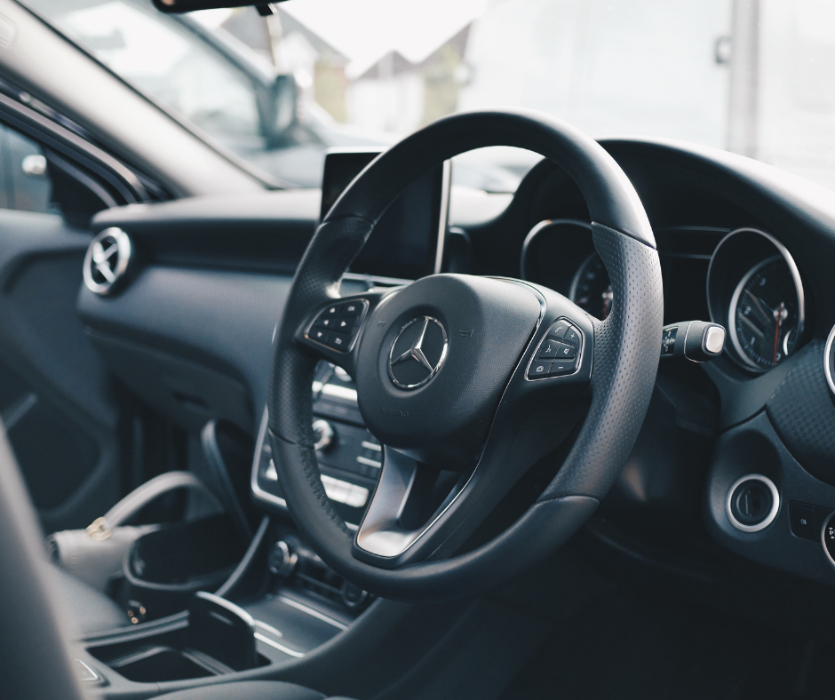 Interior of a Mercedes vehicle demonstrating money spent on expensive cars to live beyond ones means.