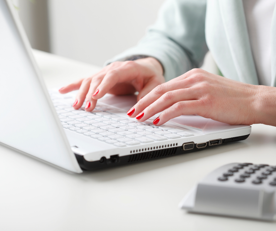 A lady working on her side hustle on her laptop.