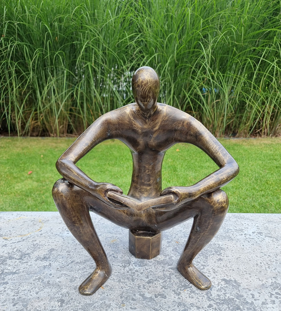 bronze sculpture of a man sitting and reading a book - abstract - modern art