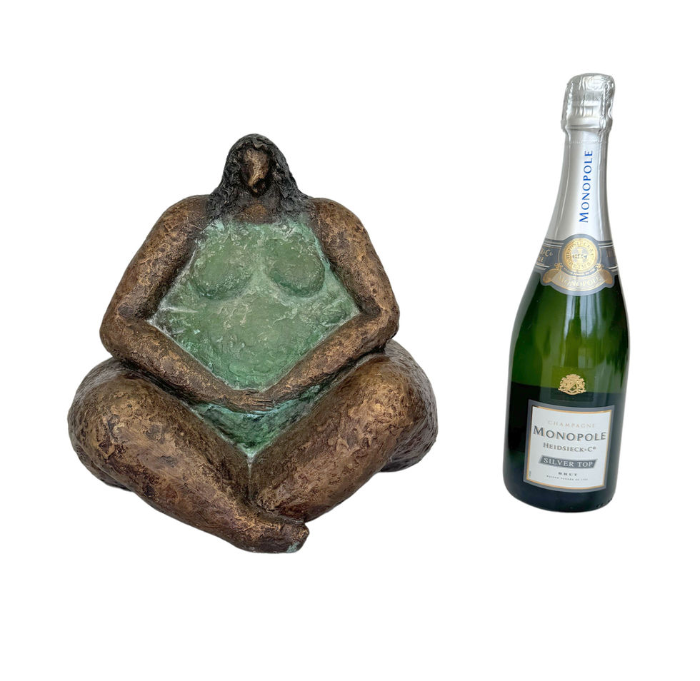 Bronze statue of a full - figured woman in yoga pose - modern art