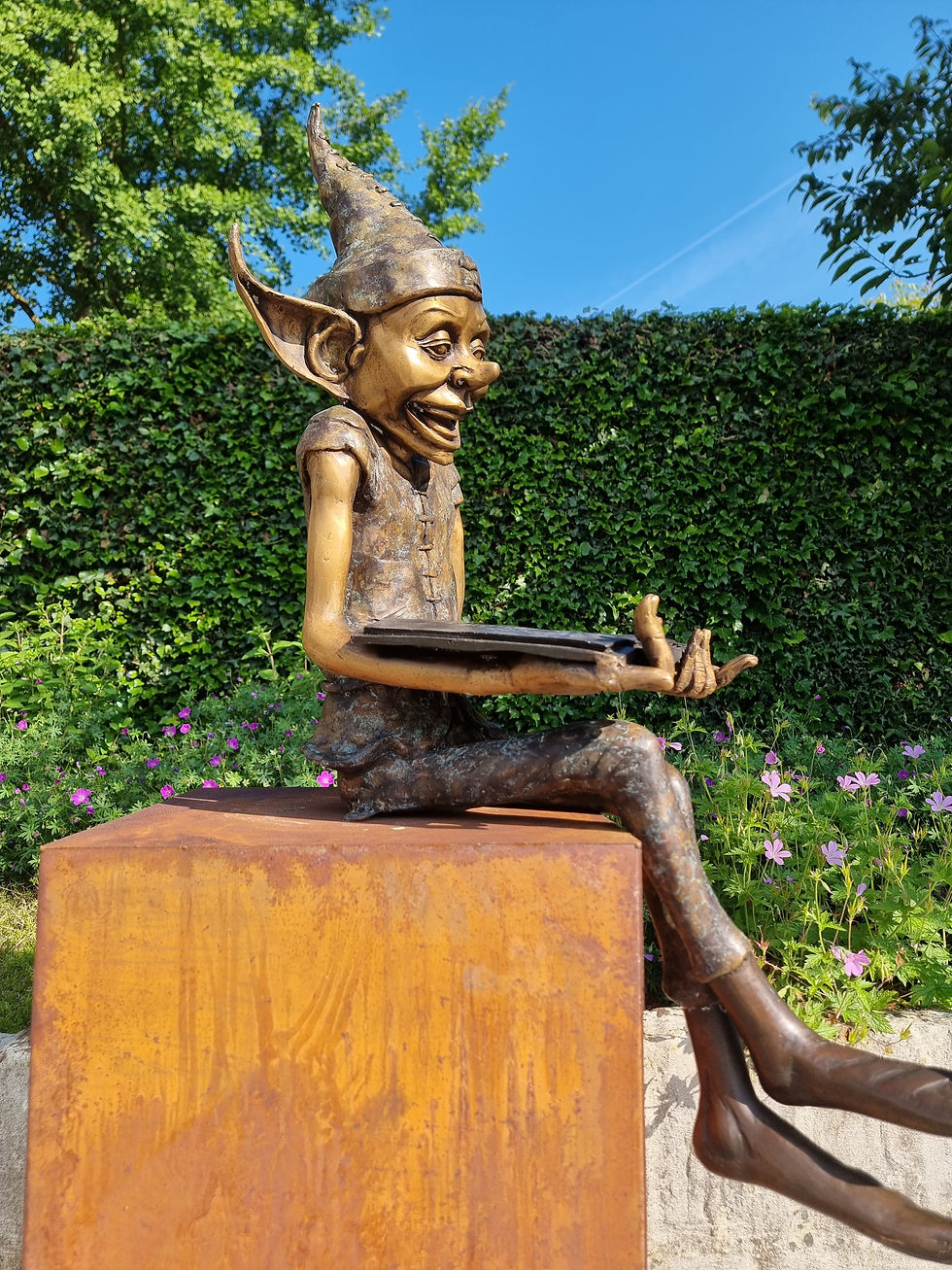 Bronze statue of a gnome reading a book - garden statues