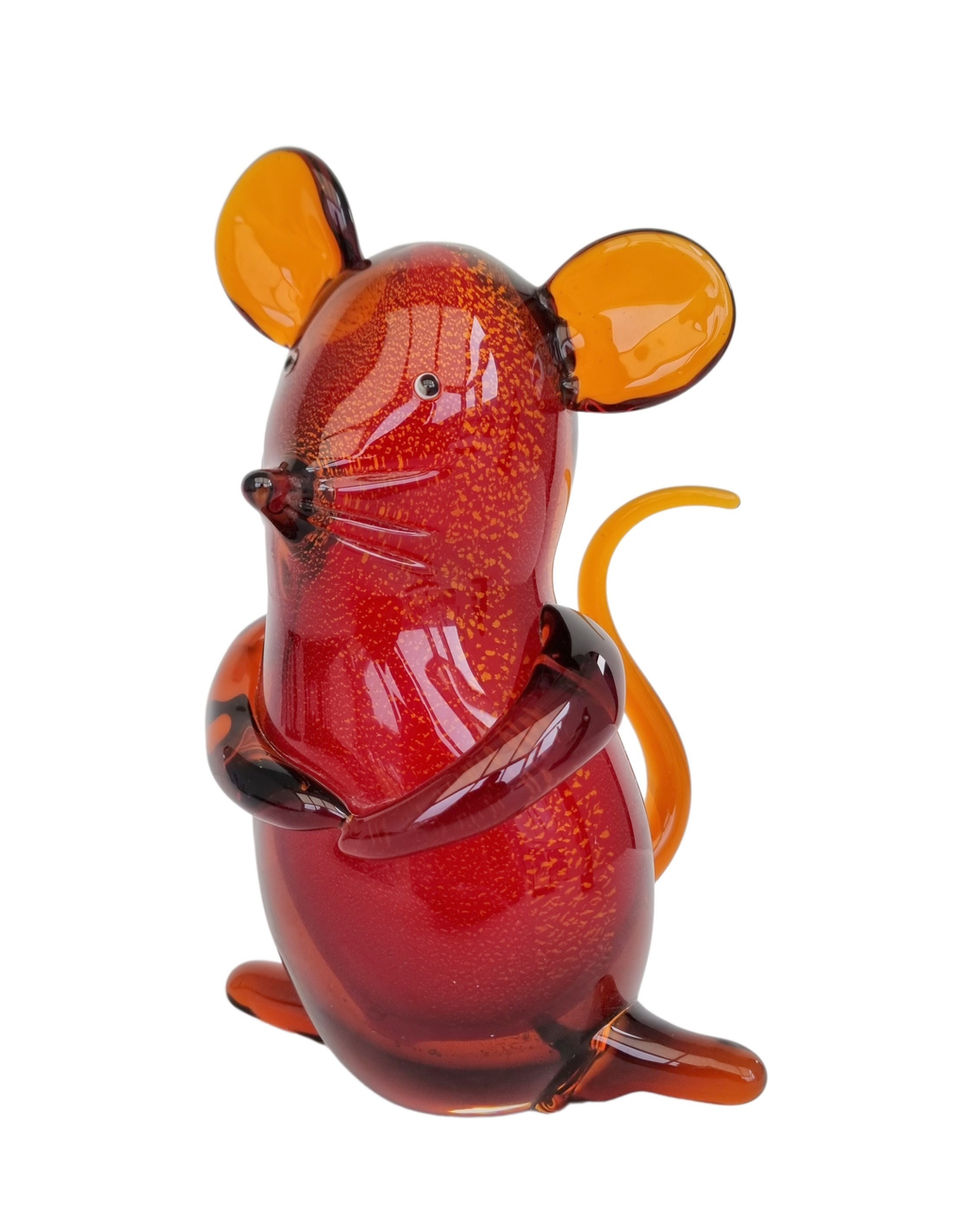 Red colored statue of a mouse made of glass - modern style