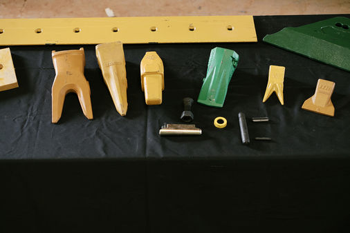 Ground engaging tools: bucket teeth, pins and retainers, plow bolts and nuts, cutting edge and side cutter.