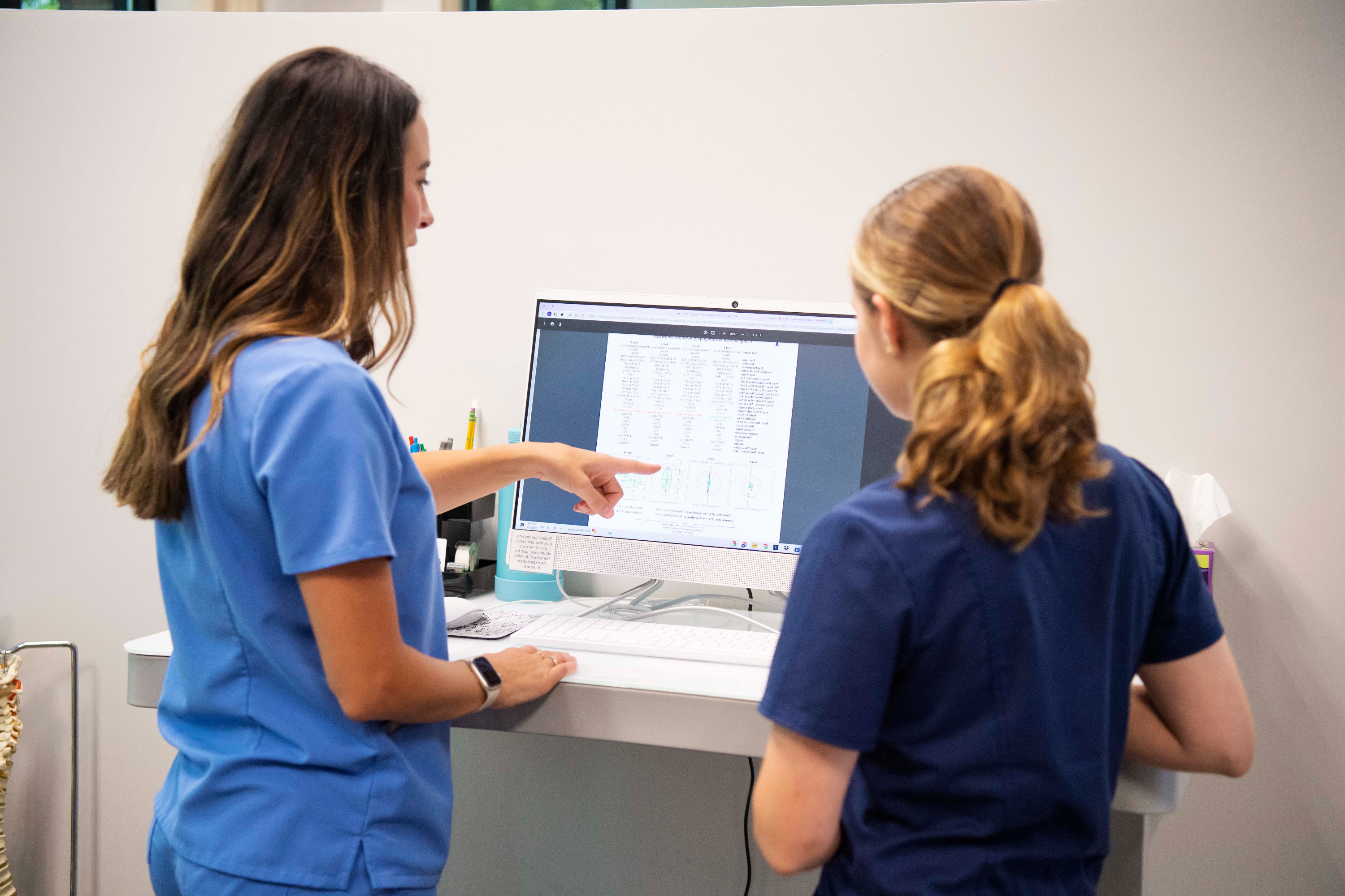 Board-certified chiropractic neurologist reviewing autonomic testing results with a POTS patient at Carolina Functional Neurology Center
