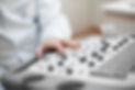 Doctor sets up an ultrasound machine, ha