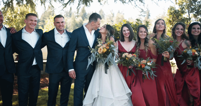 Bride with her wedding party outdoors