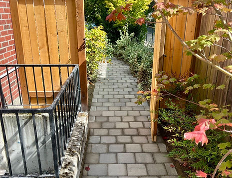 Gray pavers running bond gate fence