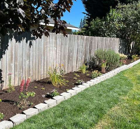 New flower bed grey wall block garden boarder sod repair