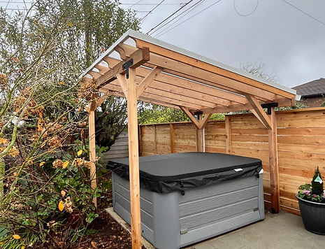 Rain feature cedar pergola curved pavers running bond hot tub
