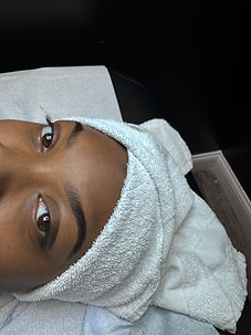 eyebrow wax and eyebrow tint done by the student on a black client