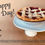 Thumbnail: Mini Cherry Pie with classic lattice on a white pedestal with the words Happy Pi Day, the pi symbol and number