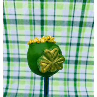 Thumbnail: GIF of a Pot-o-Gold cake pop turning to reveal a bite taken out of the back and the rainbow filling inside