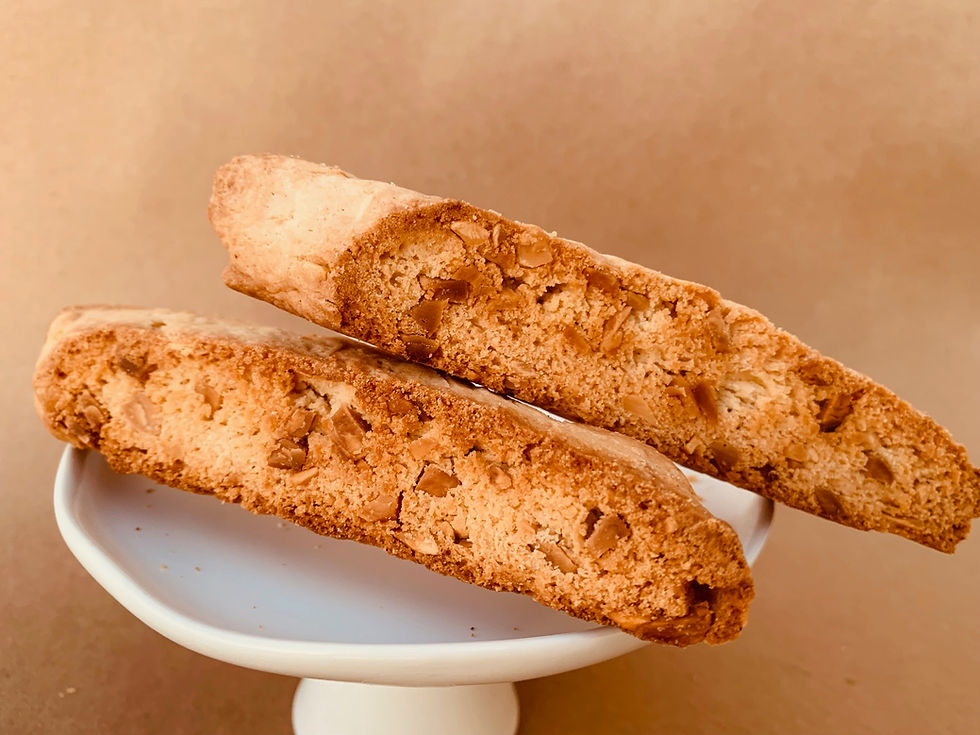 Thumbnail: two angle cut biscotti packed with toasted almonds