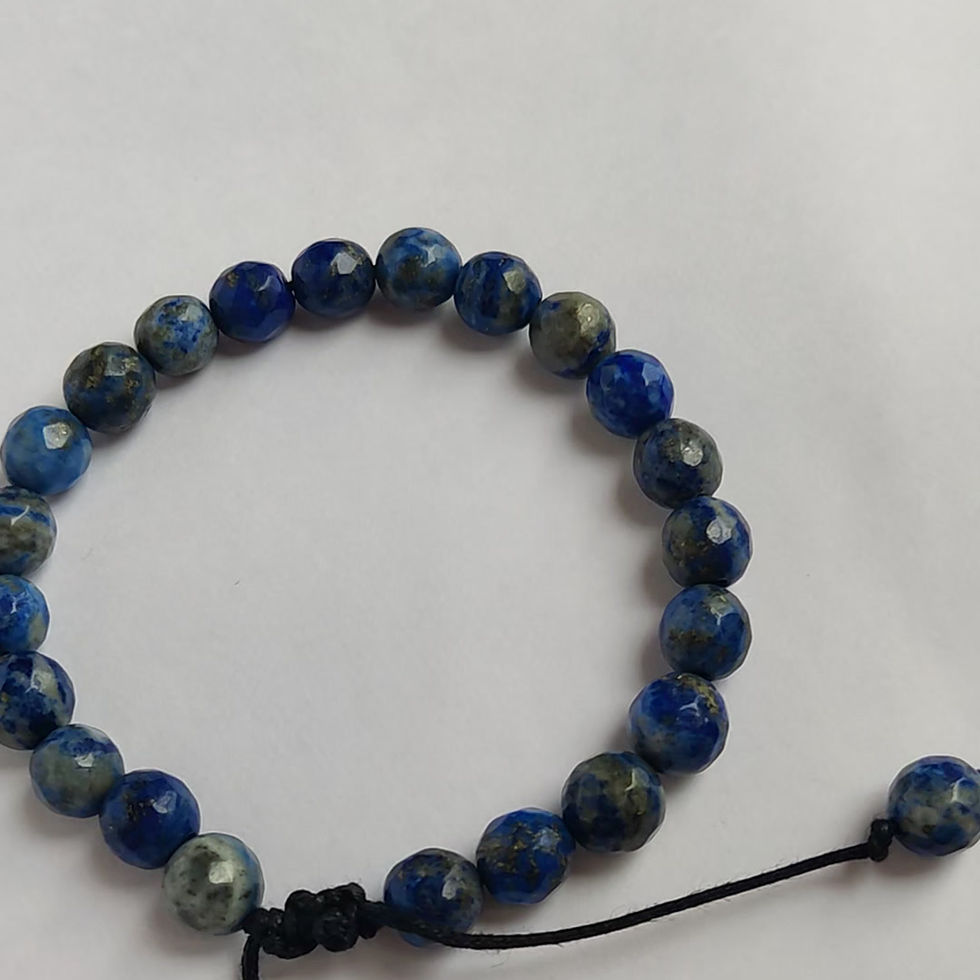 Lapis Lazuli beaded gemstone bracelet for truth, worn by men, showing the adjustable black string mechanism.