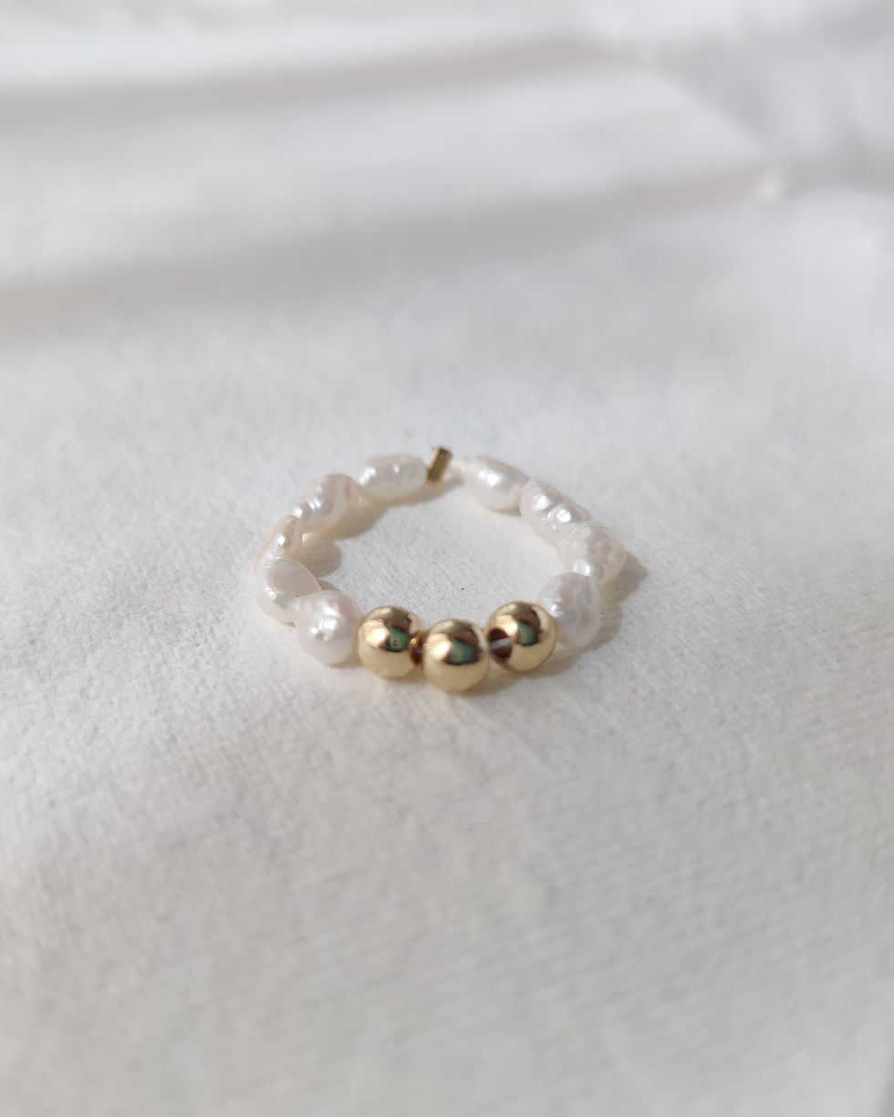 Minimal pearl ring with gold beads and June birthstone meaning by Moon’s Tribe