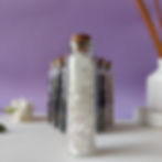 Clear Quartz Gemstone chips in a big glass jar with a cork lid.