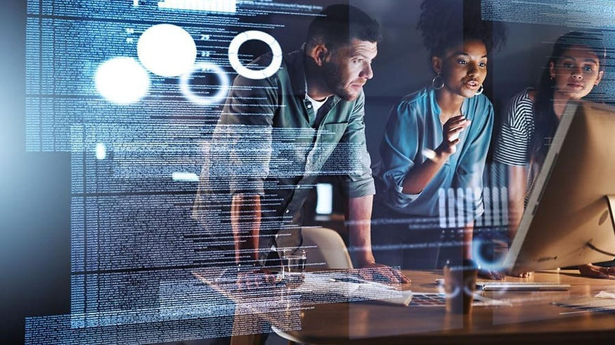 tech image of three young participants working in a data network center