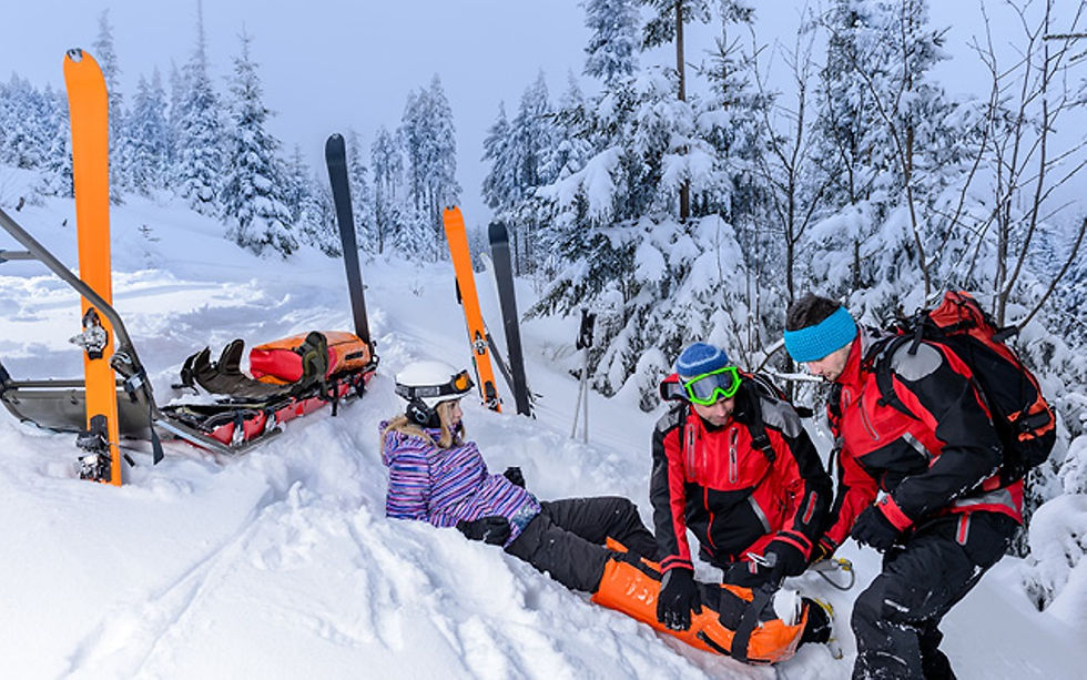Ski Patrol helping an injured person