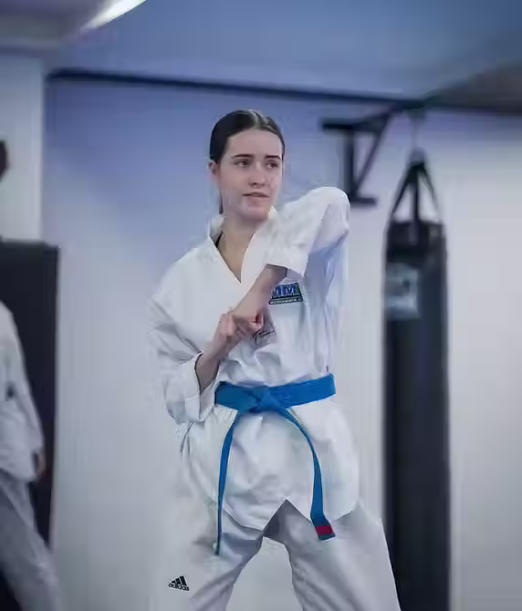 Student learning self-defense techniques in Taekwondo class at Mozhdeh Martial Arts