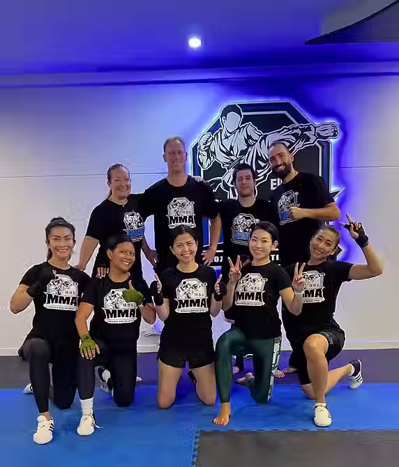 Group at Mozhdeh Martial Arts celebrating after cardio and conditioning session, building strength and endurance