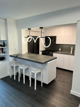 Renovated kitchen featuring modern cabinets, updated countertops, and new lighting—completed by NS Renovation’s handyman services in Central Texas

