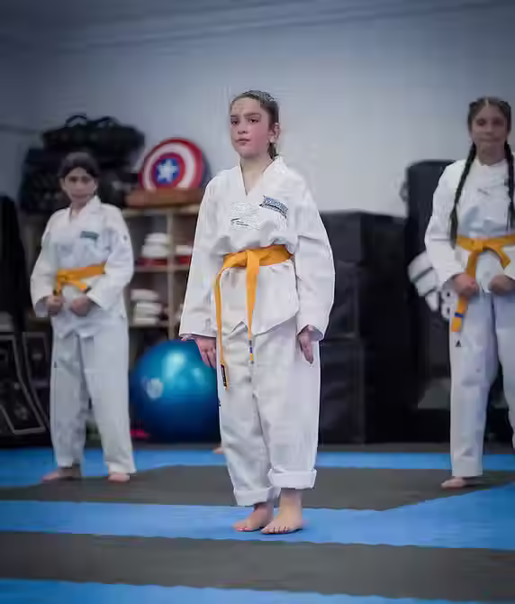 Young Taekwondo students practicing Poomsae forms at Mozhdeh Martial Arts, building discipline and precision