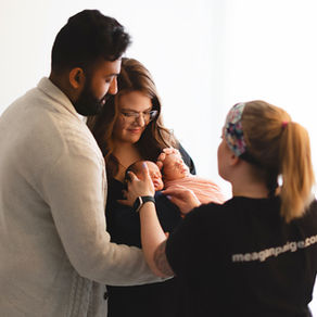 Behind the scenes of photographer Meagan Paige Photography posing a mom and dad with their newborn twins