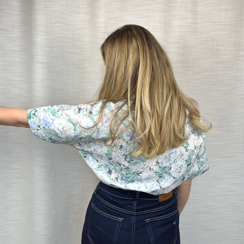 Thumbnail: Side/back view of upcycled blue floral oversized shirt with airy fit