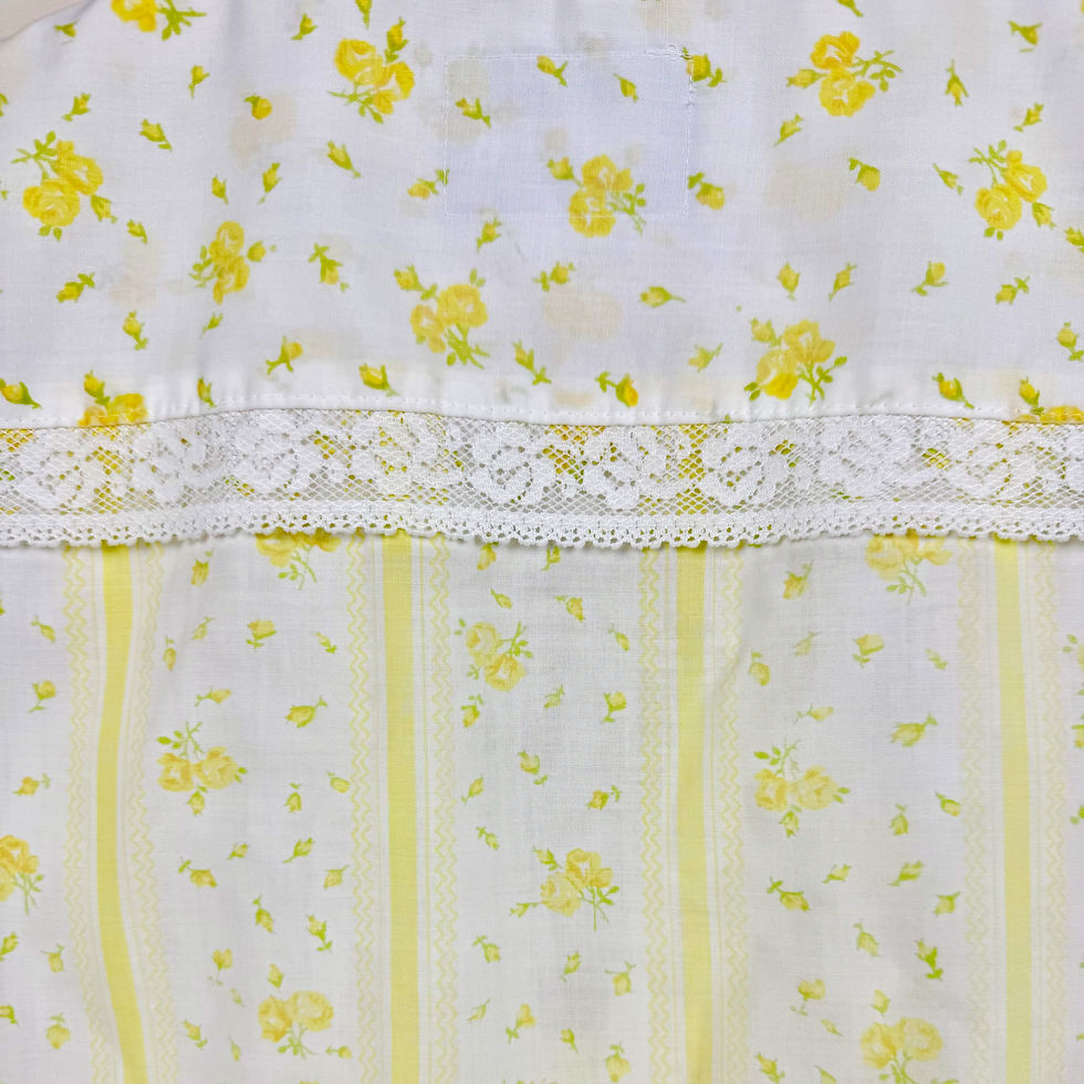 Thumbnail: Close-up of vintage cotton pillowcase fabric with yellow floral print