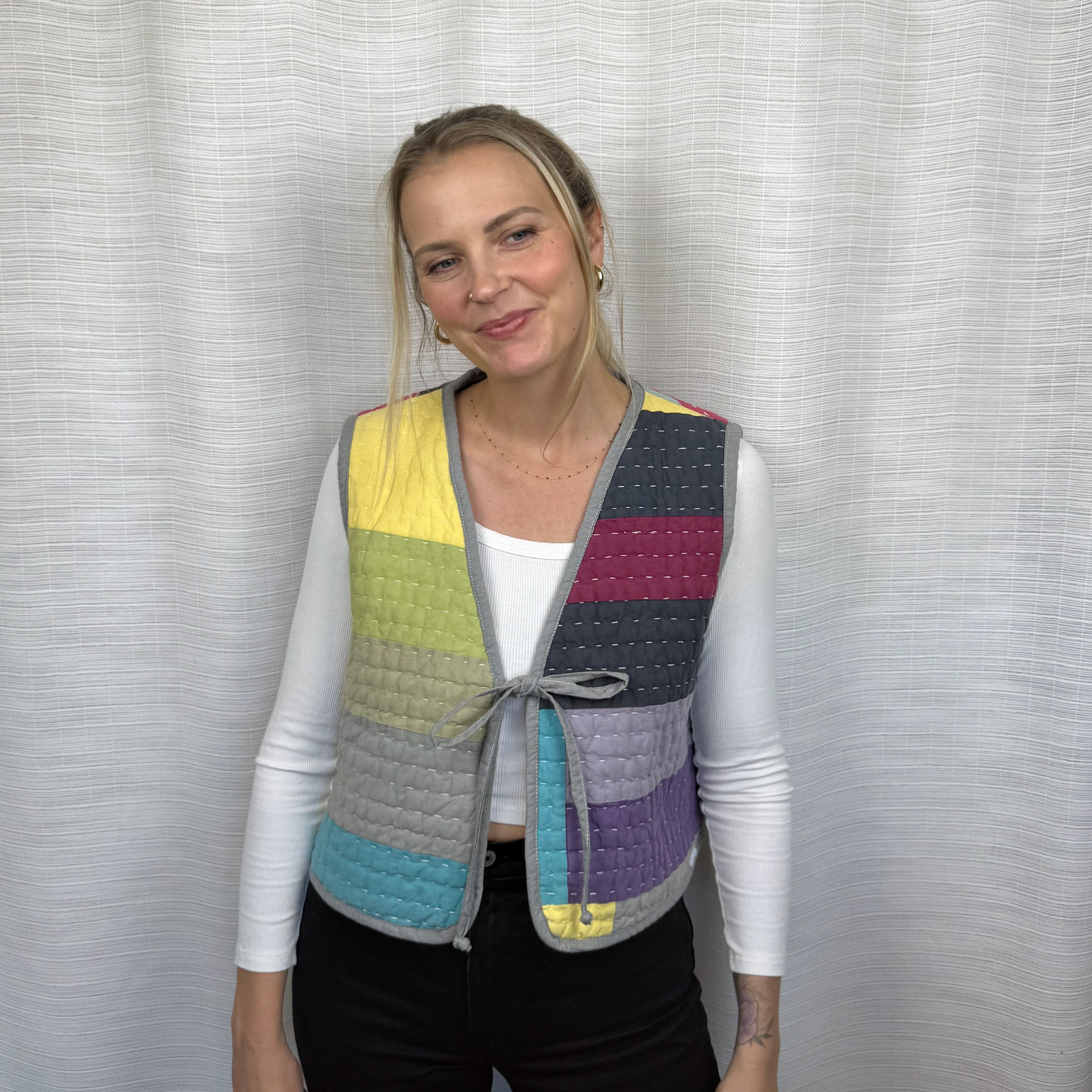 Reversible colorful quilted vest with gray ties, patchwork front view on model (XXL)