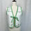 Thumbnail: Front view of upcycled green and pink floral embroidered quilted vest on mannequin