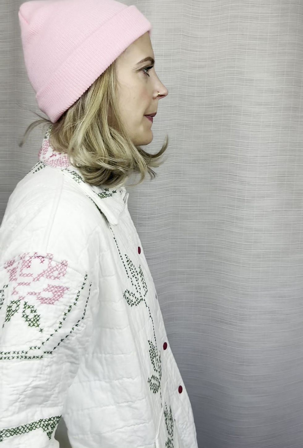 Thumbnail: Detail of collar and floral embroidery on quilted jacket