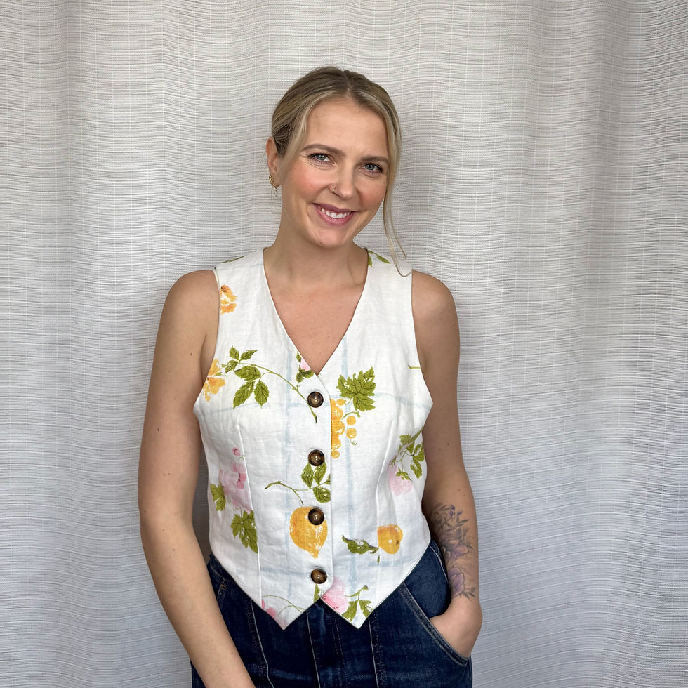 Upcycled fruit and floral waistcoat vest with wooden buttons, front view on model (S)